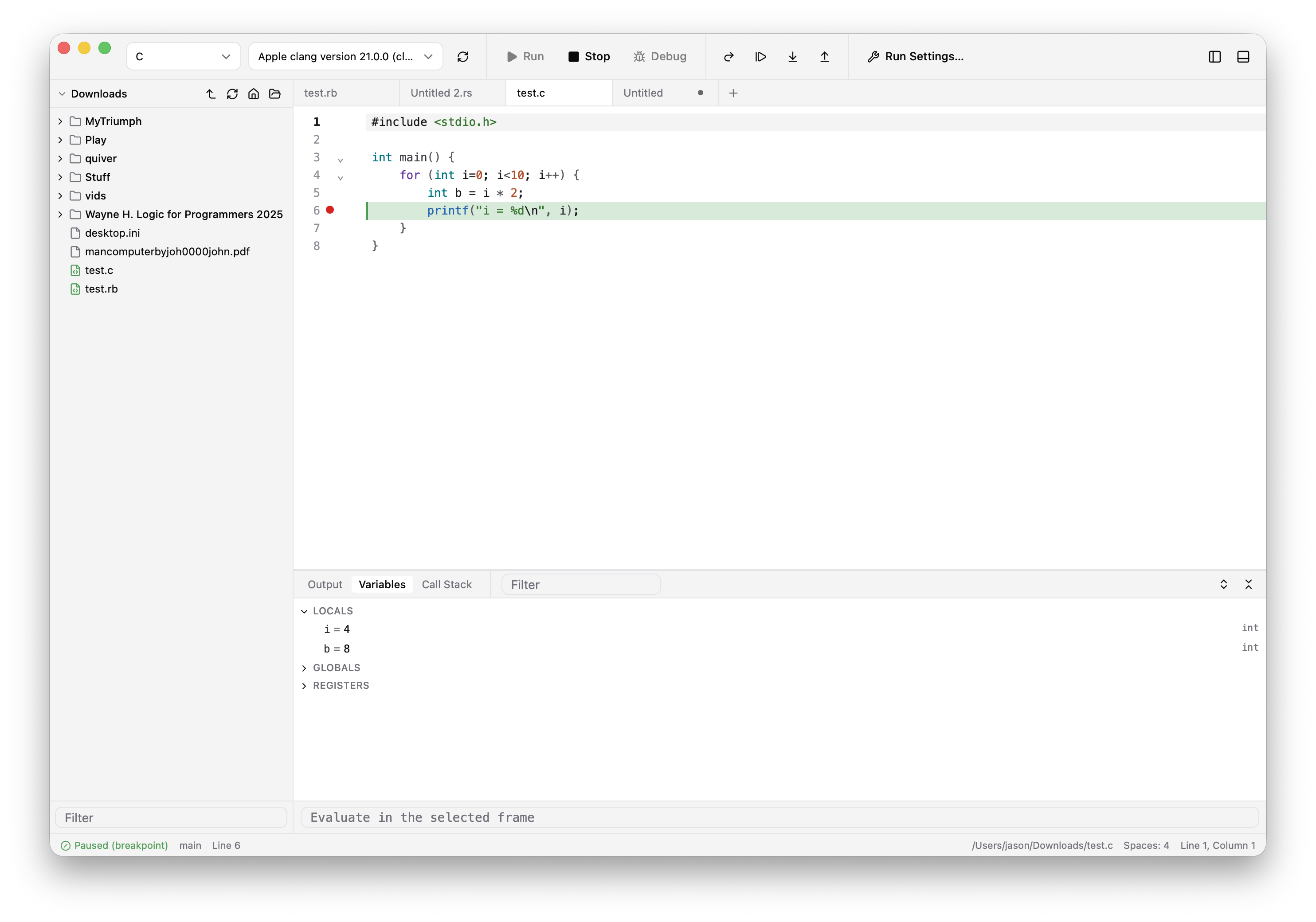 JCode paused at a breakpoint in a C program, with the current line and local variables visible.